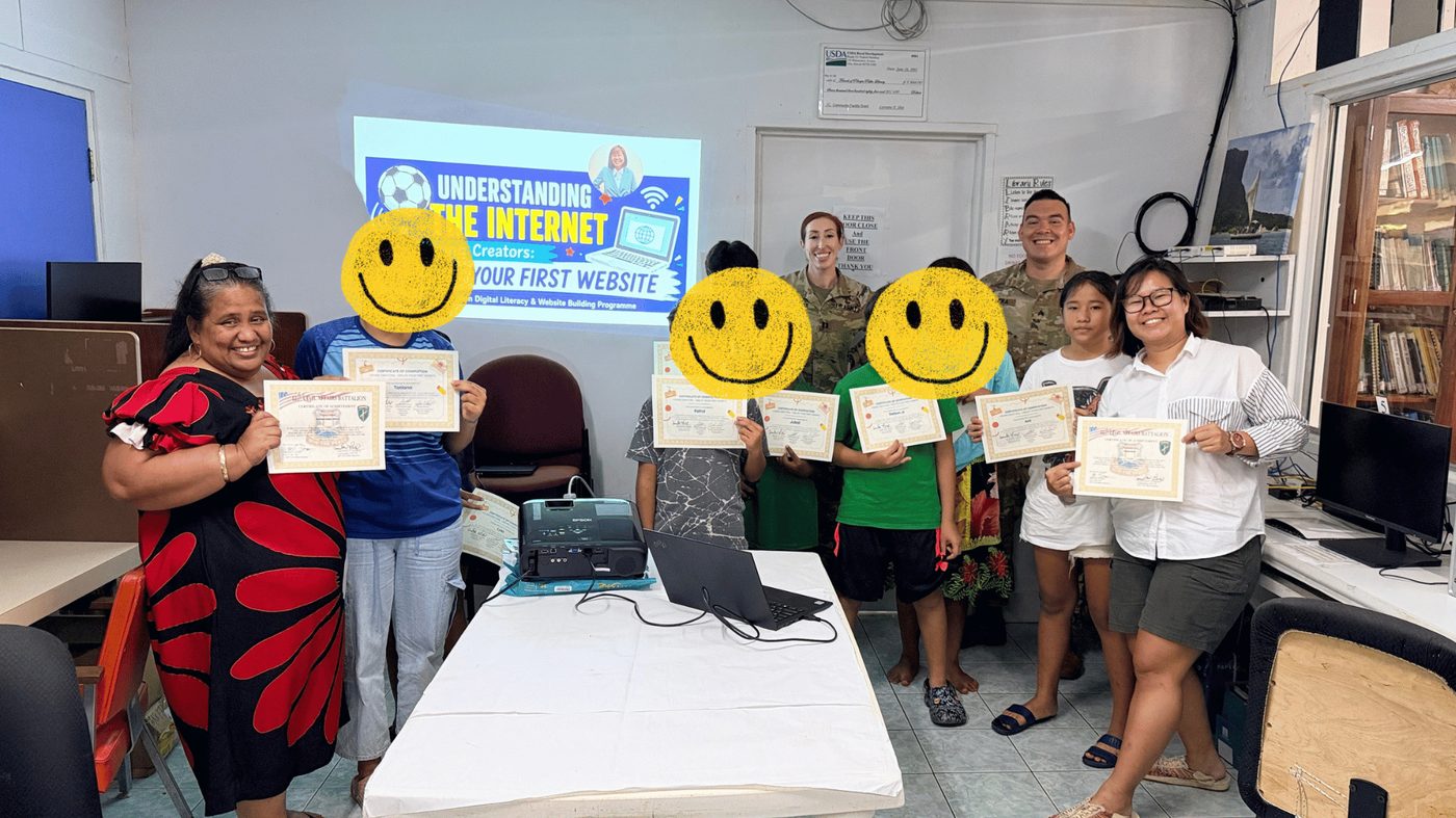 Students in Pohnpei holding their certificates after a youth digital literacy workshop